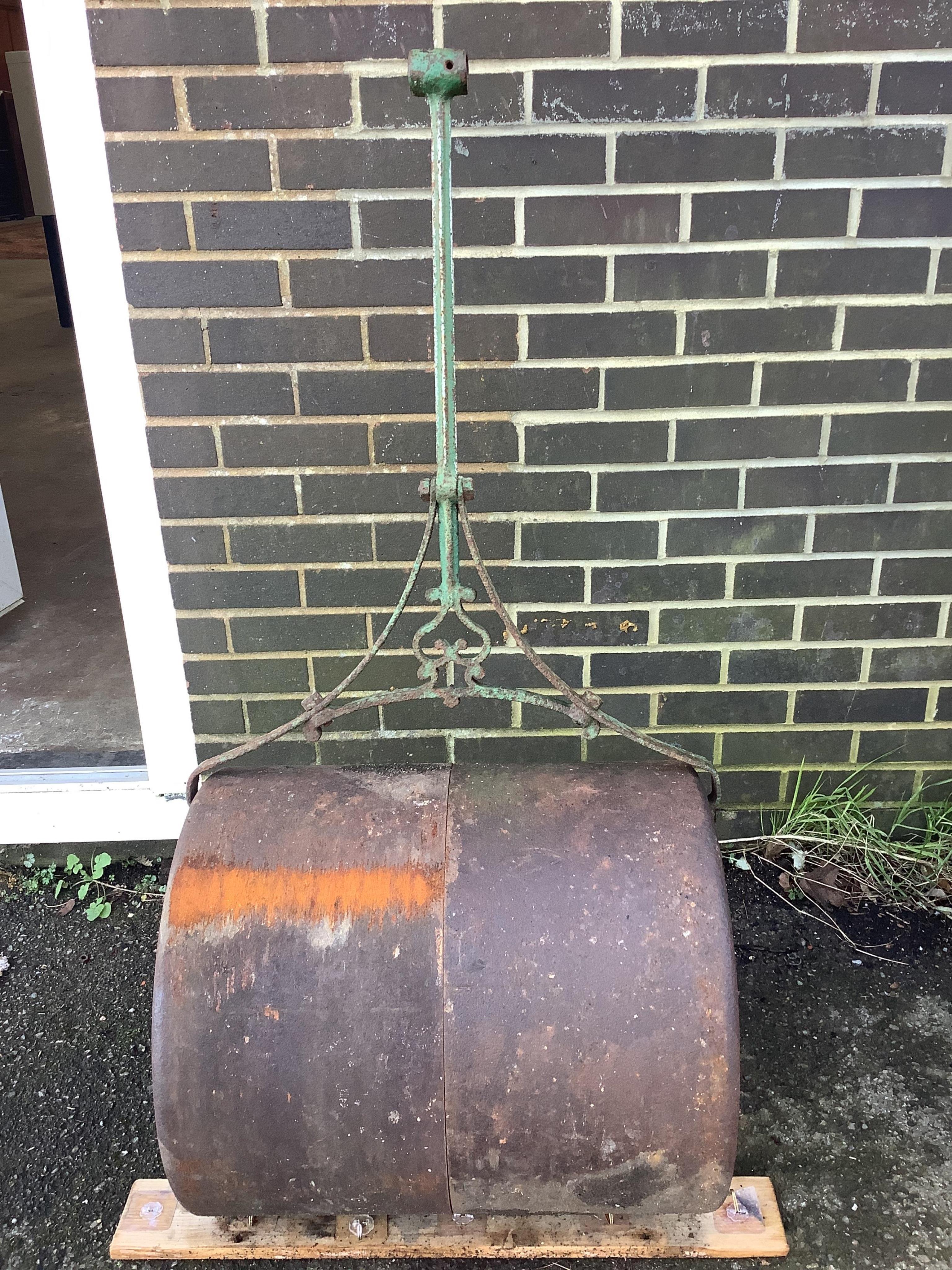 A Victorian T. Green & Son iron garden roller (lacking handle). Condition - poor